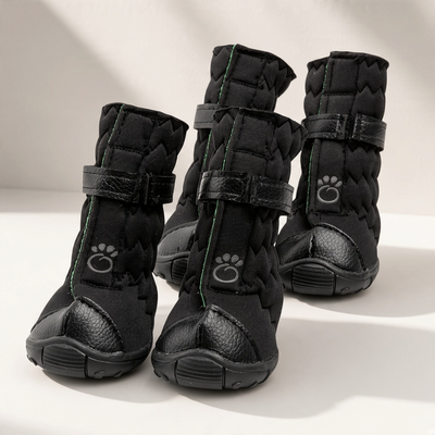 Snow Paws™ GF Pet Stretch Winter Dog Boots in black on a white tabletop